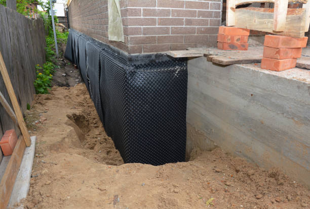 Happy homeowners after waterproofing job in Smithville